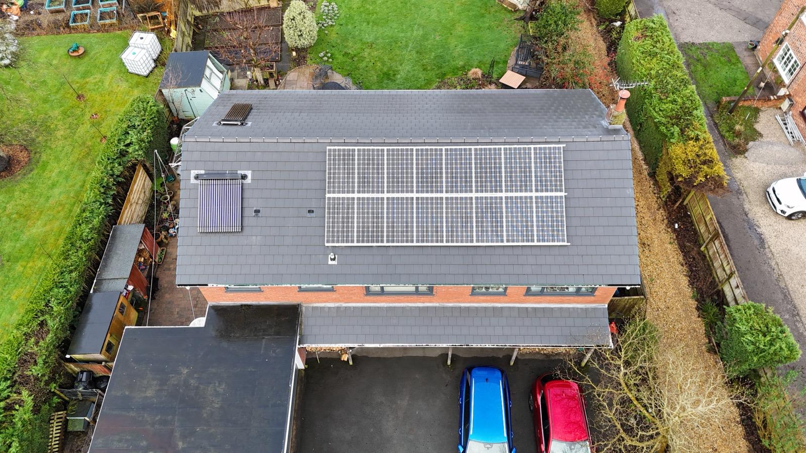 Aerial view of a large roof with solar panels installed