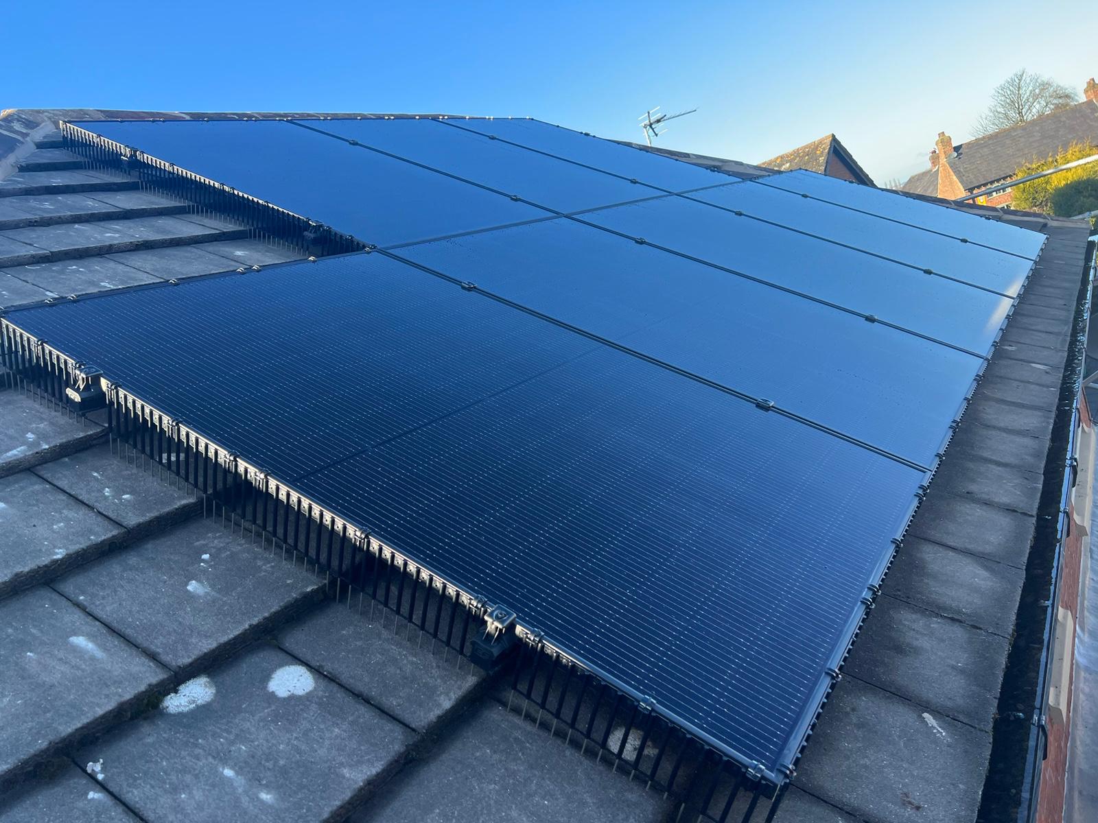 Close-up of solar panels mounted on slate roof tiles